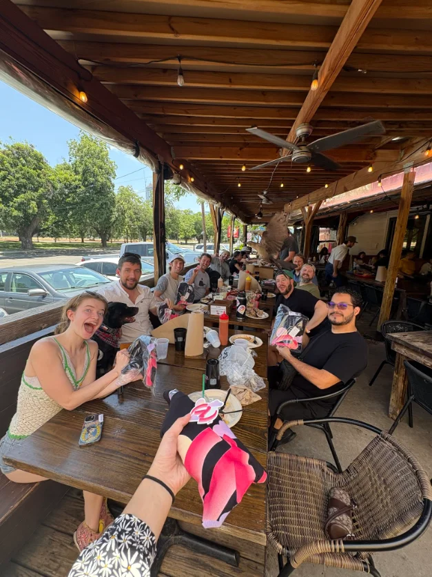 Relaxed team portrait at an outdoor table